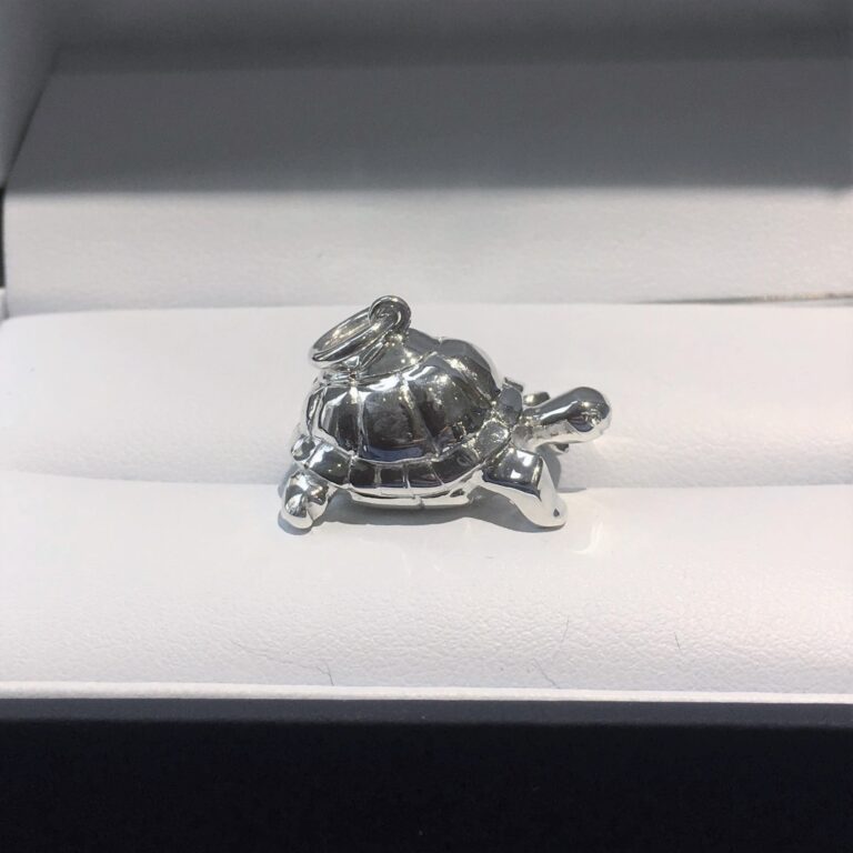 Silver charm carved in wax